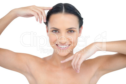 Smiling attractive topless model gesturing