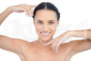 Smiling attractive topless model gesturing