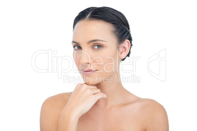 Sensual nude model posing hand on her chin