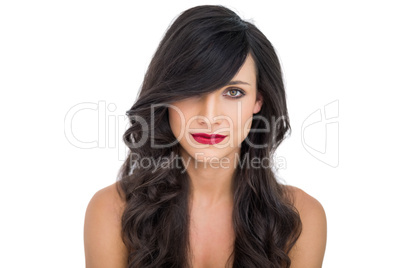 Pretty dark haired woman posing with red lips