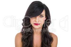 Pretty dark haired woman posing with red lips