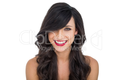 Cheerful dark haired woman posing