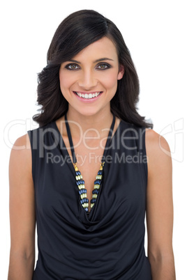 Smiling brown haired model with classy clothes posing