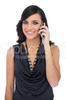 Elegant brown haired model talking on the phone