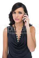 Anxious elegant brown haired model on the phone