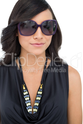 Elegant dark haired model wearing sunglasses