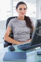 Serious businesswoman sitting on her swivel chair