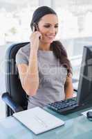 Cheerful gorgeous businesswoman on the phone