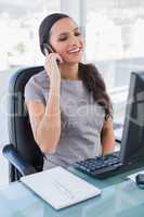 Smiling gorgeous businesswoman on the phone