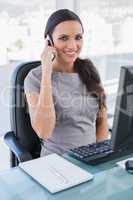 Smiling gorgeous businesswoman having a phone call