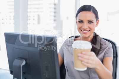 Attractive businesswoman offering coffee