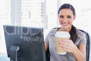 Attractive businesswoman offering coffee