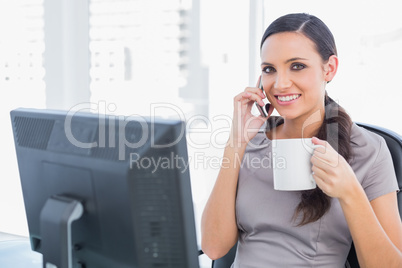 Smiling businesswoman having a break