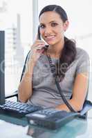 Smiling secretary answering land line