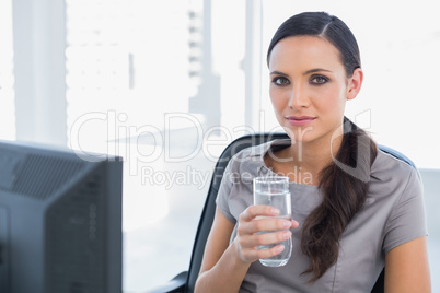 Attractive secretary holding water