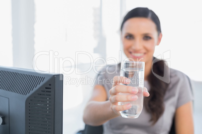 Gorgeous secretary offering water