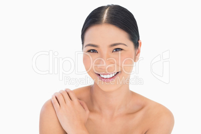 Portrait of smiling natural dark haired model