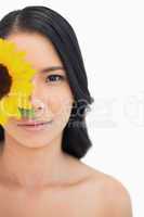 Natural black haired model with sunflower