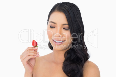 Natural brown haired model with strawberry