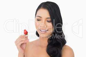 Natural brown haired model with strawberry