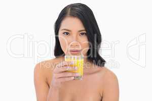 Sensual nude model having orange juice