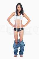 Womans jeans falling down as shes lost weight