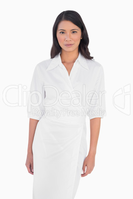 Elegant dark haired model with white dress