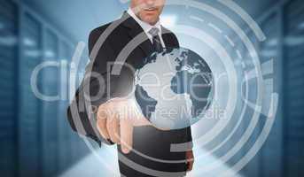 Businessman touching earth on futuristic interface