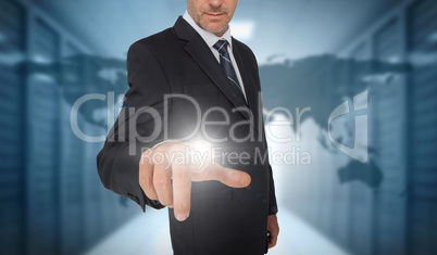 Businessman touching futuristic interface with world map on back
