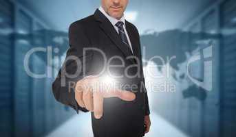 Businessman touching futuristic interface with world map on back