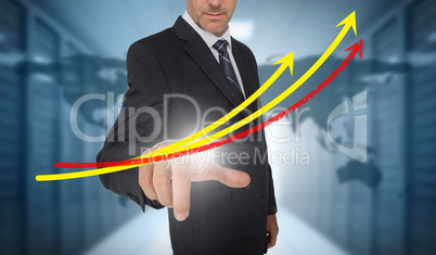 Businessman touching red and yellow growth lines with world map