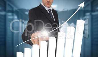 Businessman touching bar chart interface with world map on backg