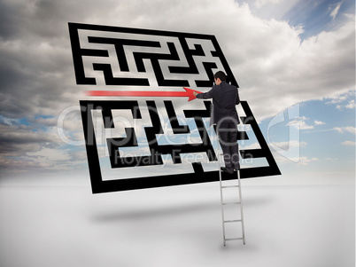 Businessman on ladder drawing red line through qr code