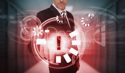 Businessman touching futuristic warning icon interface