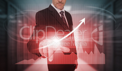 Businessman pressing red growth arrow and graph interface