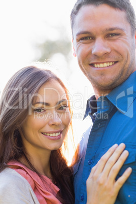 Happy couple standing outside