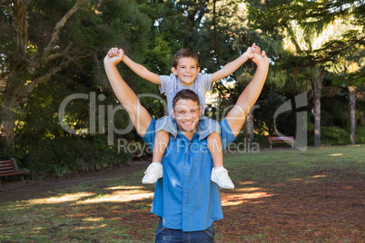 Father holding his son on shoulders