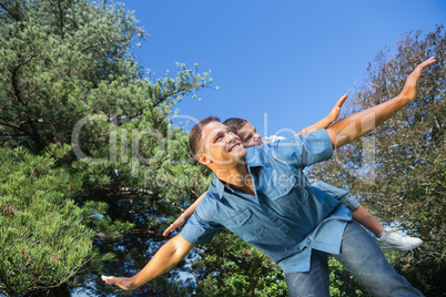 Father and son playing in a park