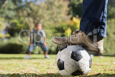 Father and son playing football