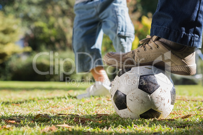 Child kicking the ball