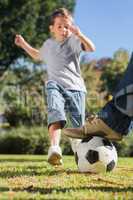 Boy kicking the football