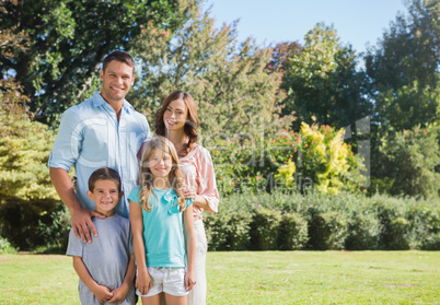 Family standing in a park