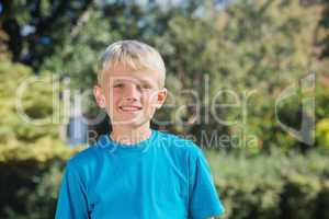 Blonde boy smiling at camera