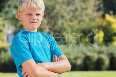 Blonde boy looking angry