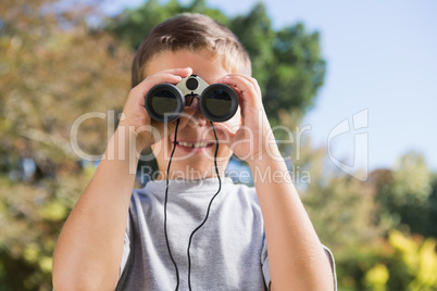 Boy looking through binoculars