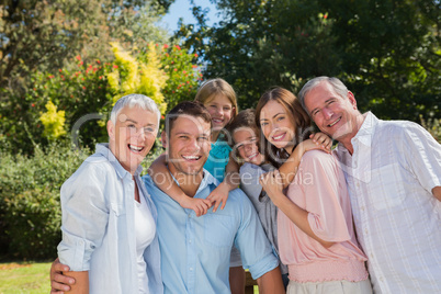 Smiling family and grandparents in the countryside