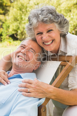Happy mature couple smiling at camera