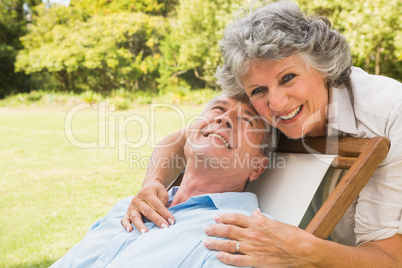 Smiling mature man lying on sun lounger