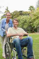 Happy man in wheelchair with partner