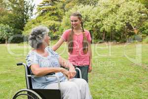 Granddaughter with grandmother in her wheelchair